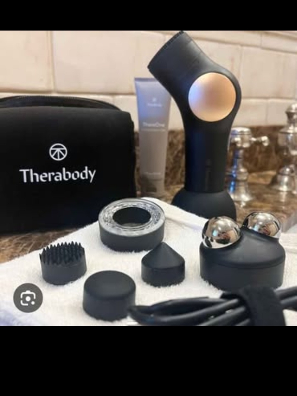Therabody Percussive Massage Device in Black with Rose Gold Accent